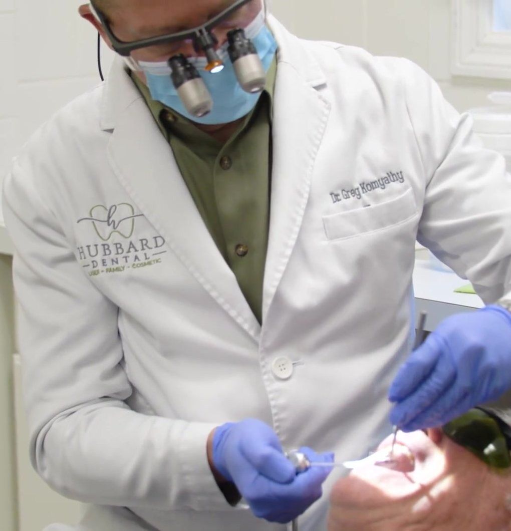 Hubbard Dental A dentist treating a patient at Hubbard Dental in Pinehurst, NC